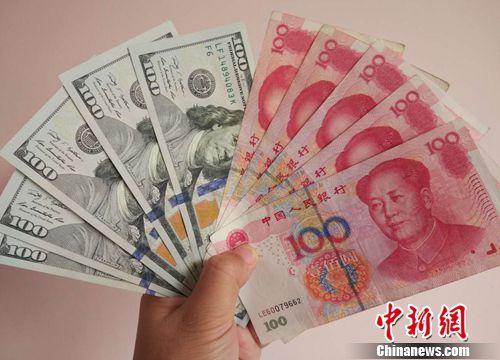 資料圖：人民幣和美元。<a target='_blank'  >中新網</a>記者 李金磊 攝